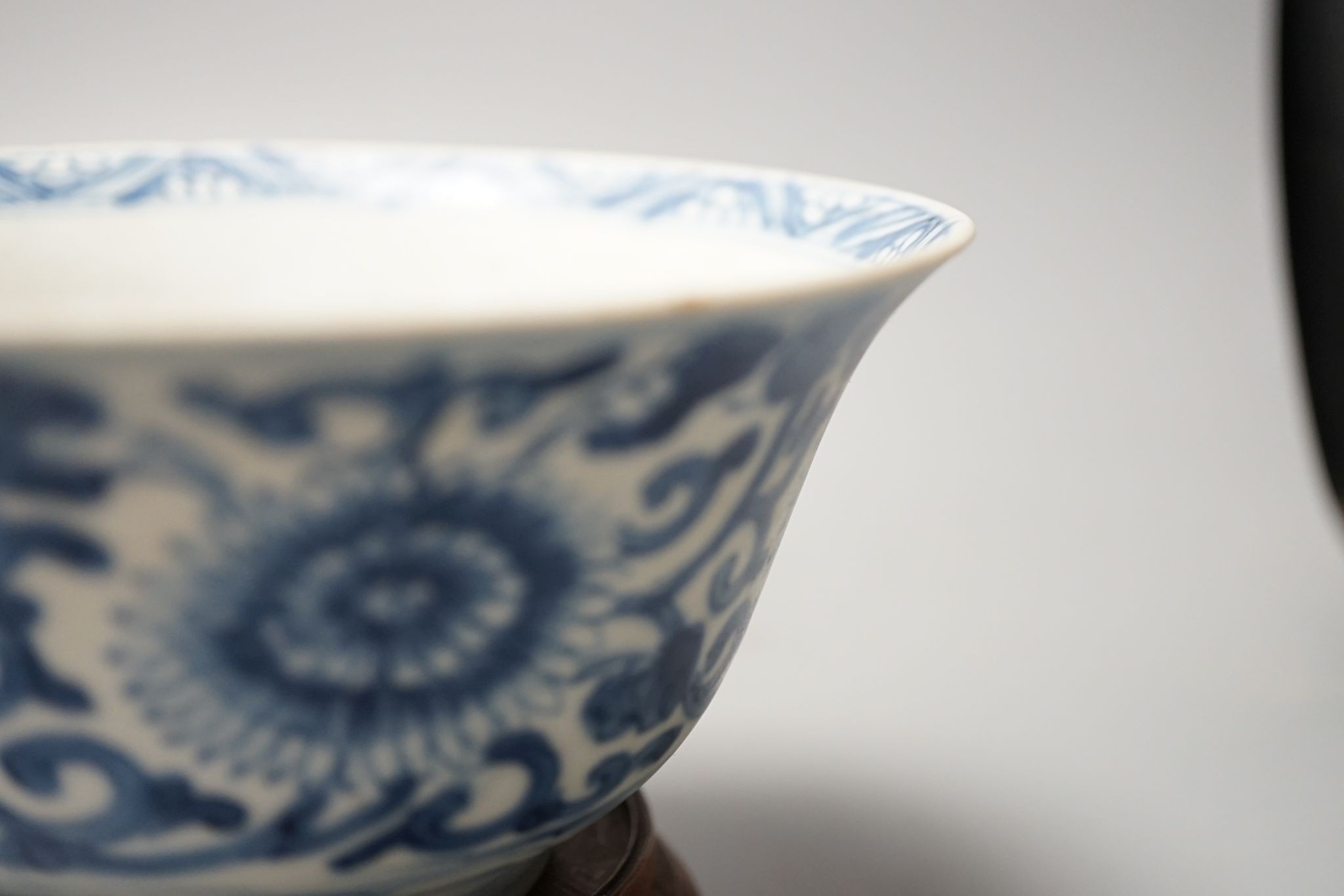 A Chinese blue and white bowl, Kangxi, 15cm. diam., a famille rose teapot stand, Yongzheng, and two doucai bowls